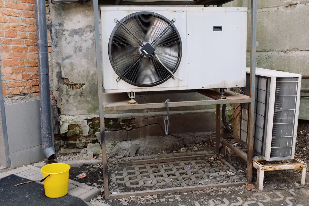 Outdoor air conditioner condensers beside a building